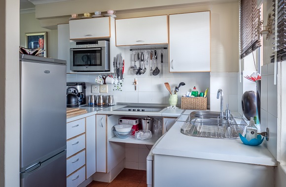 What are the benefits of installing shelving in the kitchen? 